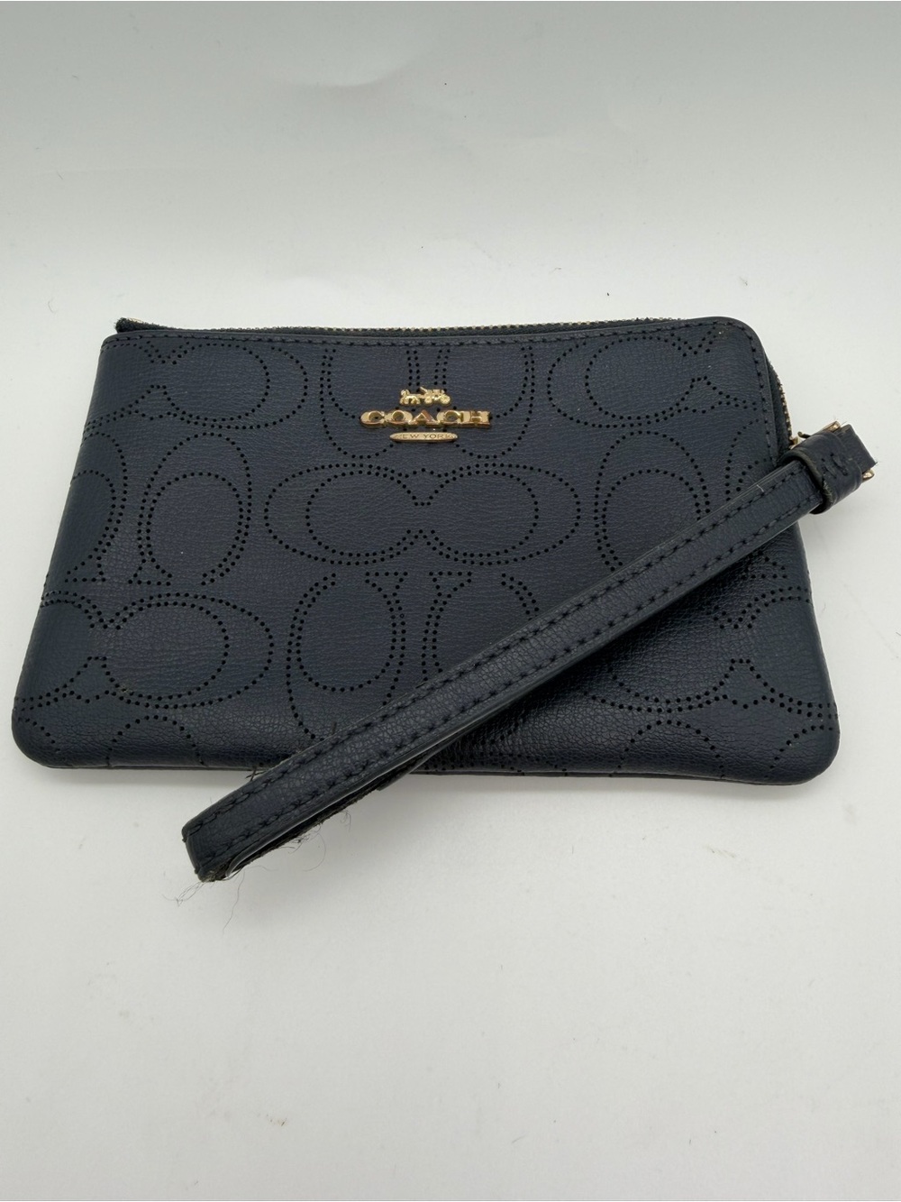 Coach Navy Perforated Signature C Wristlet with Gold Logo